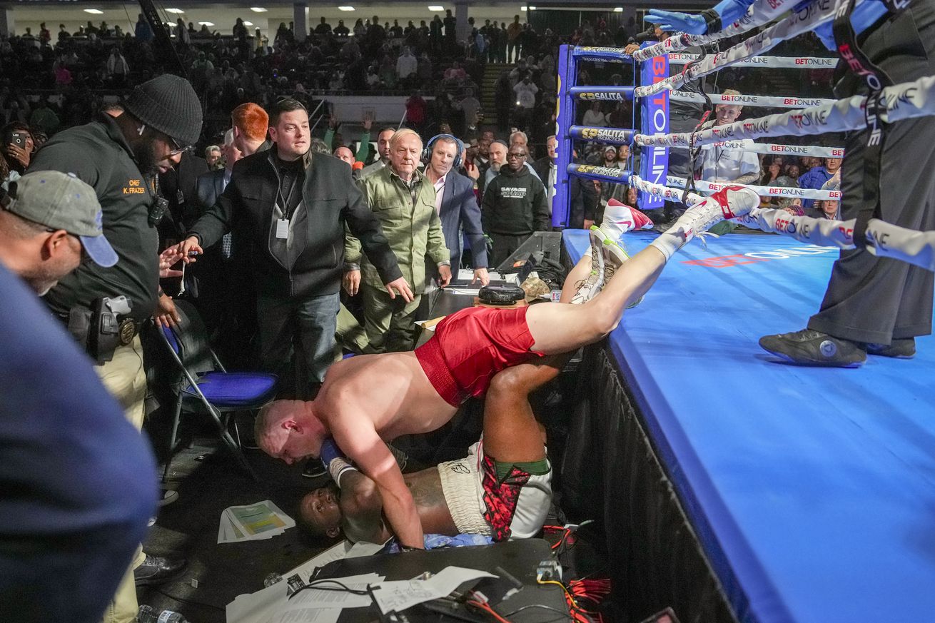 Watch Brandon Moore win boxing title after Skylar Lacy drives him into the crowd in bizarre scene