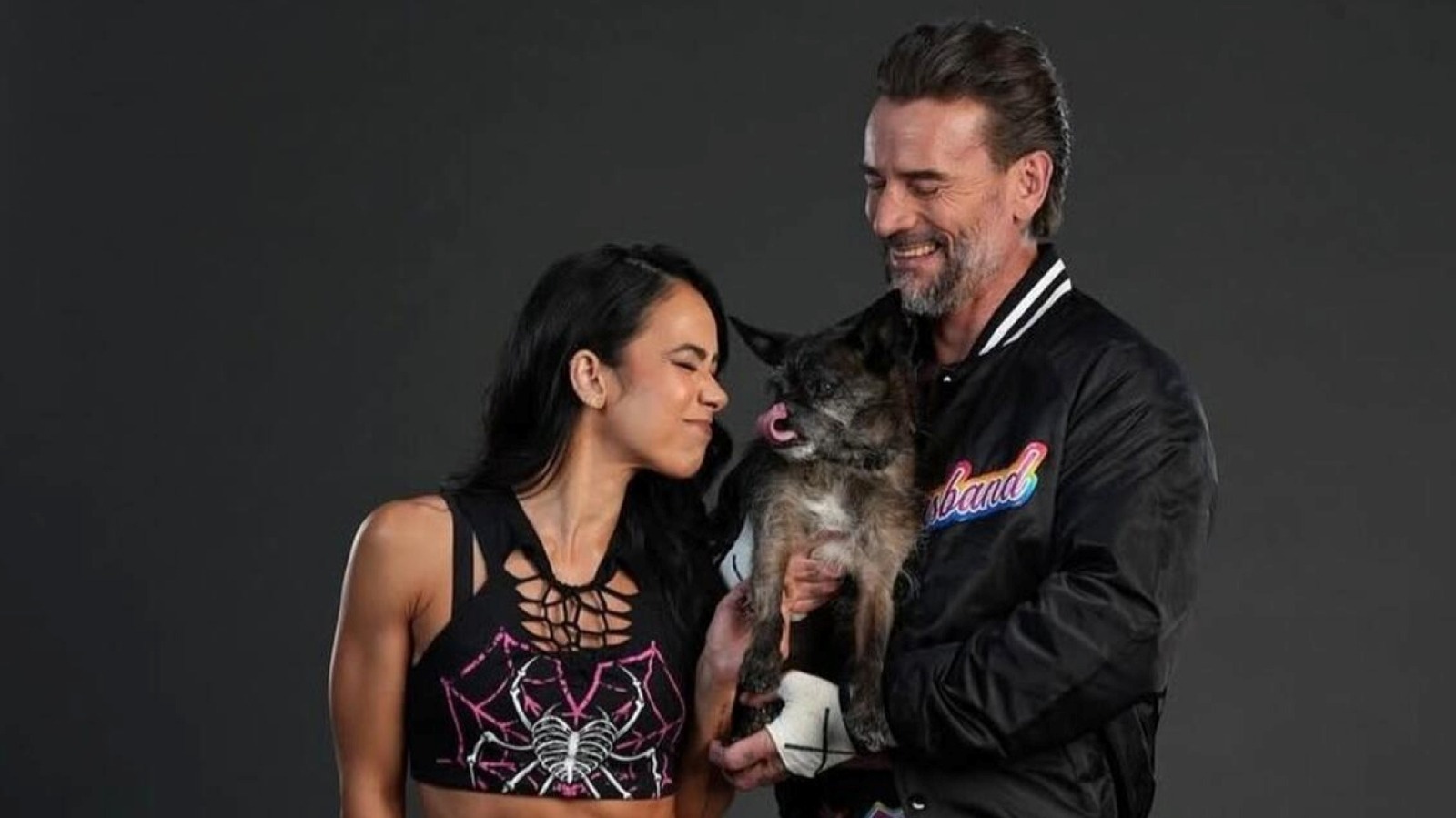 WWE Stars CM Punk & AJ Lee Reflect On Passing Of Their Dog Larry